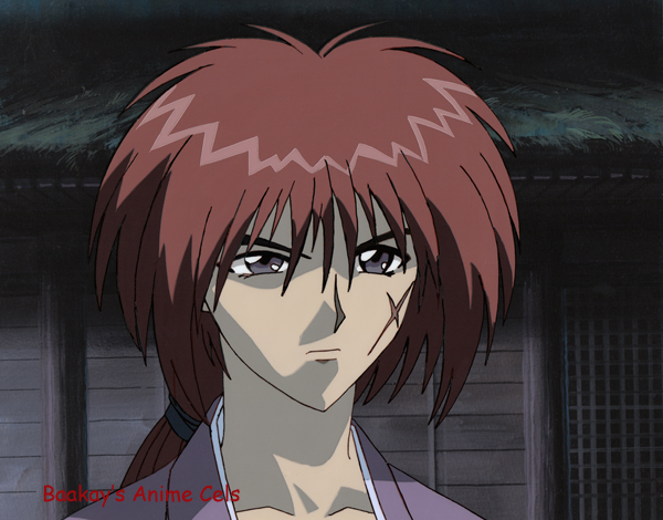 Kenshin stands in front of a dark building at night.